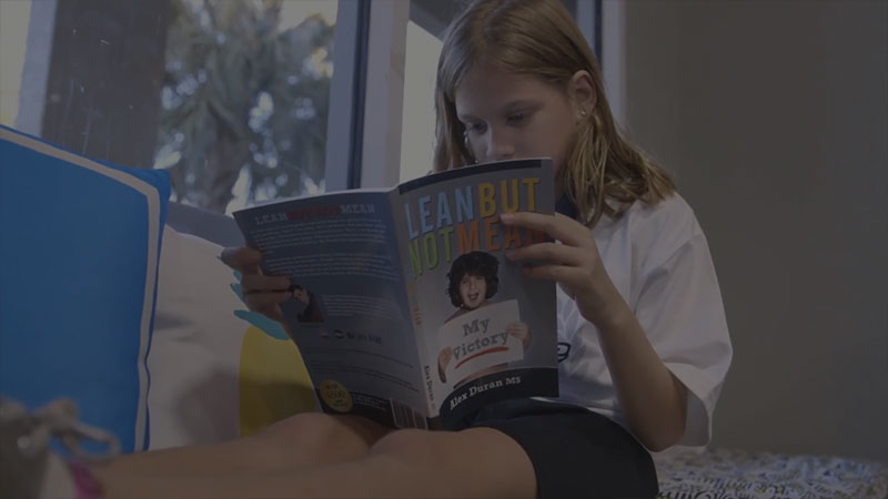 Young girl reading a book